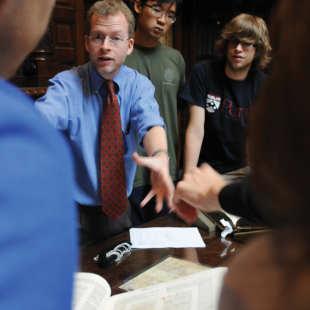 John Pollack, Library Specialist, talks with students in the Lea Library of the Kislak Center