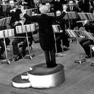 Stokowski, on his personal podium, conducting the Philadelphia Orchestra, from the Leopold Stokowski Papers