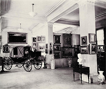 Photograph including the carriage in which Empress Eugenie escaped at the fall of the Second Empire.