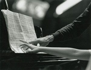 Hands of pianist Rieko Aizawa and cellist Paul Tortelier at the piano, 1992. Photo by Peter Checchia.