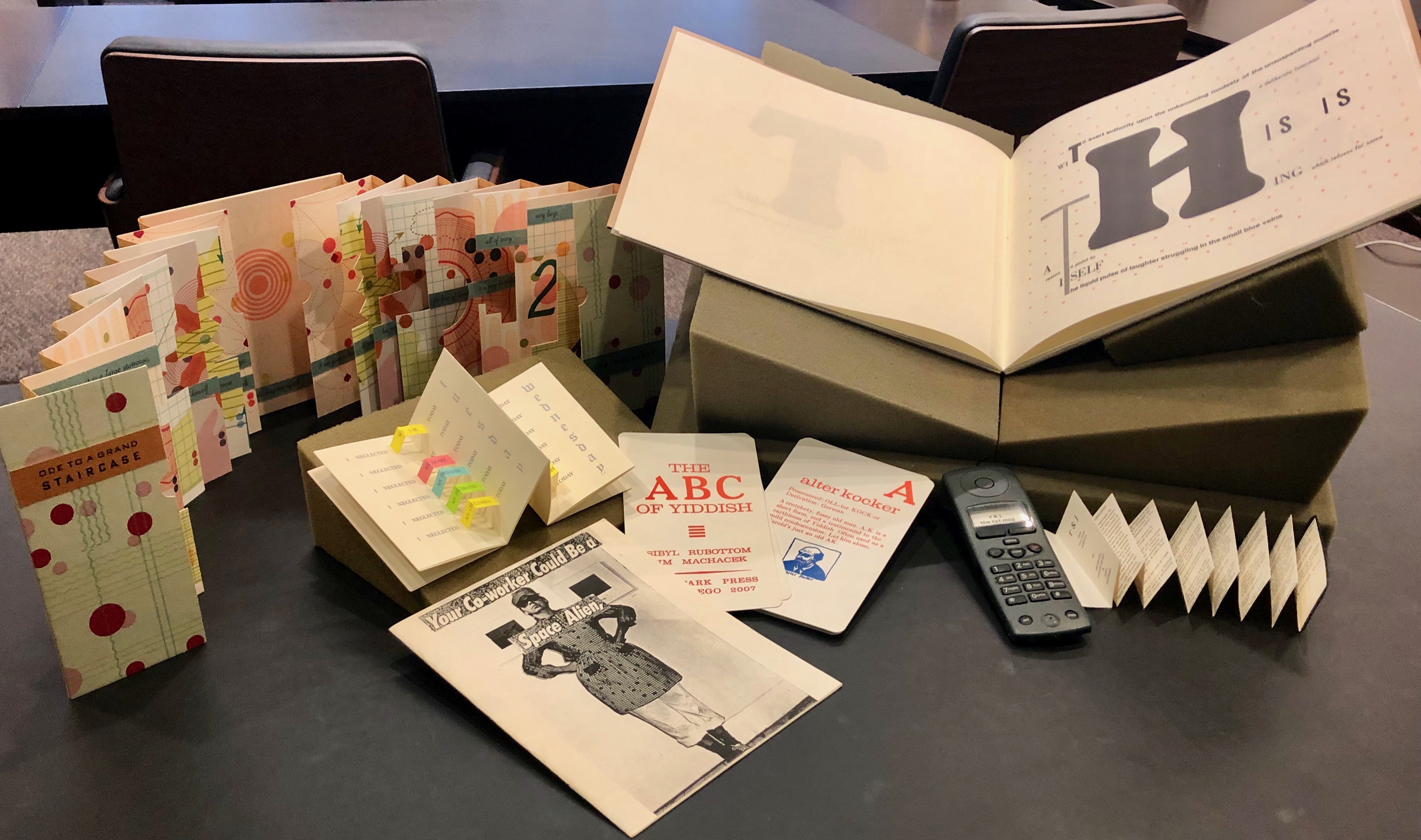 A collection of artists' books from the Kislak Center for Special Collections. Books by (clockwise from upper right): Johanna Drucker, Elizabeth Pendergrass, Sibyl Rubottom, Tana Kellner, Patricia M. Smith, and Julie Chen. Photo by Camille Davis.