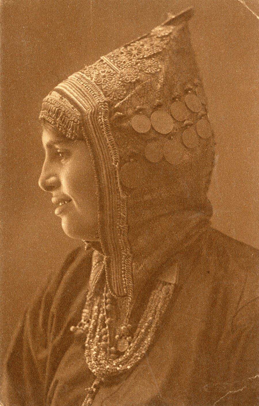 Faded photograph of woman in profile