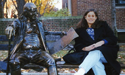 Photograph of Lisa Beth Deutsch on a campus bench
