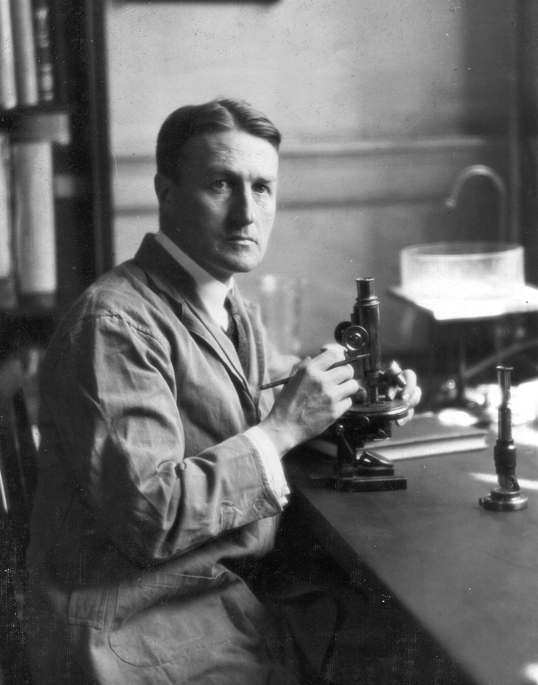 Edward Bell Krumbhaar (1882-1966), with microscope, portrait photograph