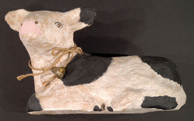 Papier-mache model of a cow.