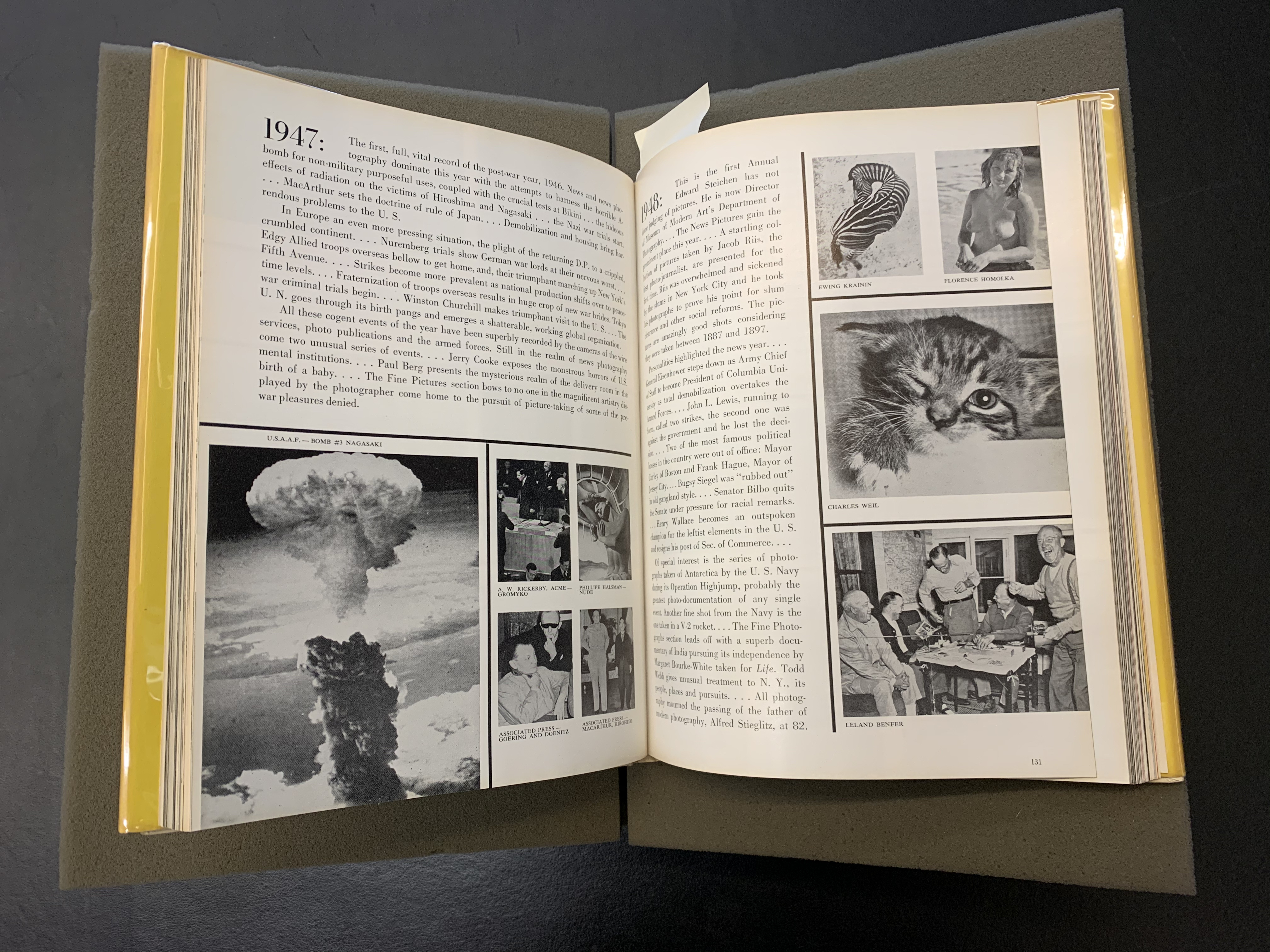 Open copy of The Picture Universe showing photographs from the year 1947