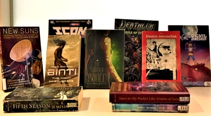 A stack of books with titles including Mothership Connection, New Suns, Moon Girl and Devil Dinosaurs, The Fifth Season, The Night Masquerade, The Summer Prince