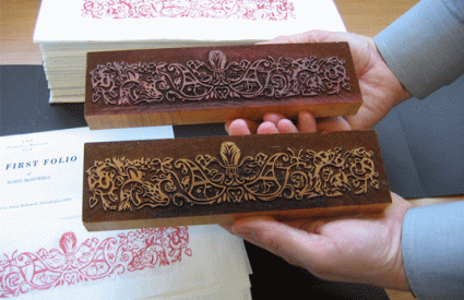 Hands holding two blocks with decorative border