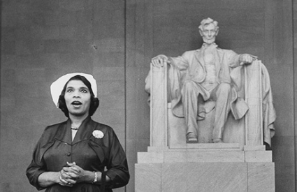 Marian Anderson singing at the Lincoln Memorial. Seated statue of Lincoln in the background.