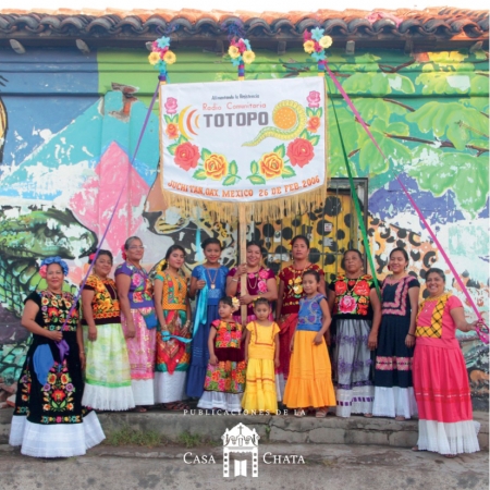 Book cover featuring photo of Latin American women in brightly colored dresses
