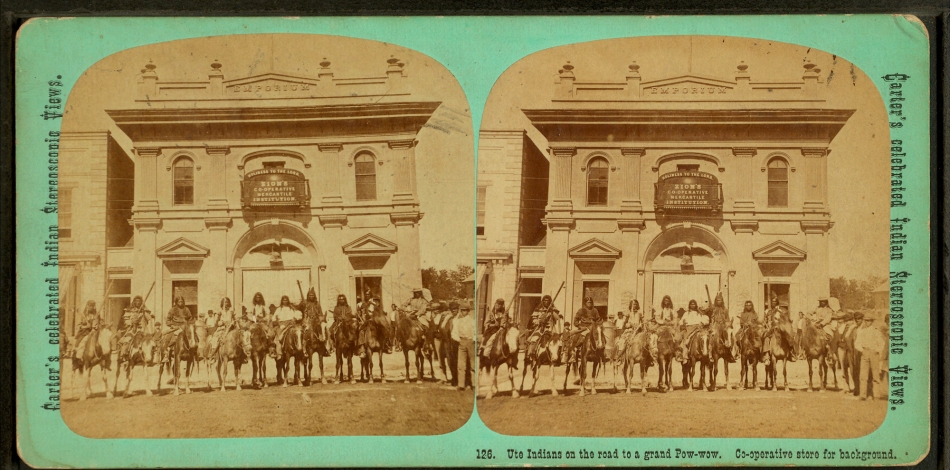 Sepia-toned stereograph showing a group of people on horseback in front of a storefront