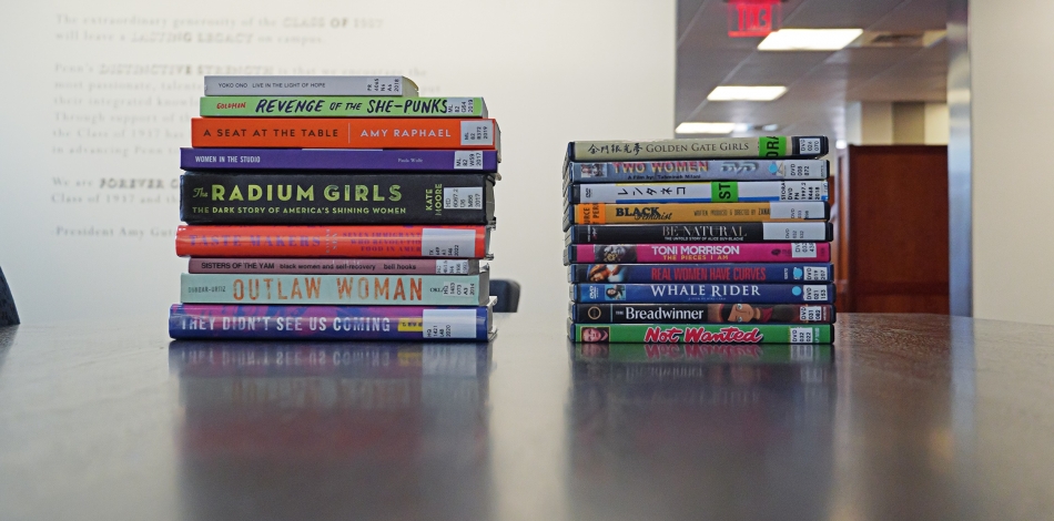 Stack of books and movies featuring stories about women