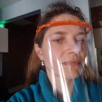 Photo of Varvara modeling plastic face shield with 3D printed headband