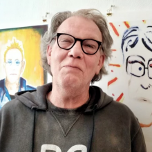 Photograph of Borje Bengsston with art in the background